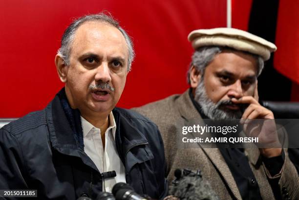 Omar Ayub Khan , nominee for prime minister from Pakistan Tehreek-e-Insaaf party speaks as Sahibzada Muhammad Hamid Raza, leader of the political...