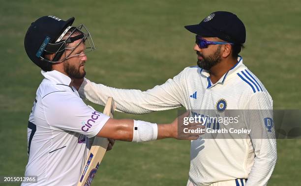 England batsman Ben Duckett is congratulated by India captain Rohit Sharma as he leaves the field at close of play unbeaten on 133 runs during day...