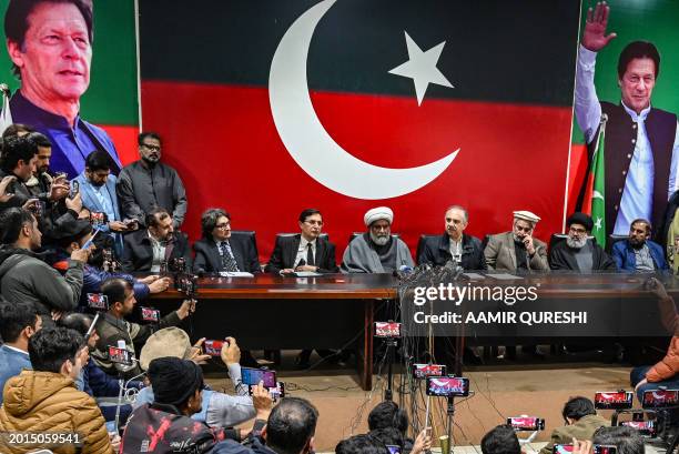Omar Ayub Khan , Pakistan Tehreek-e-Insaaf party's nominee for prime minister speaks as Gohar Ali Khan , PTI's chairman and barrister with Sahibzada...