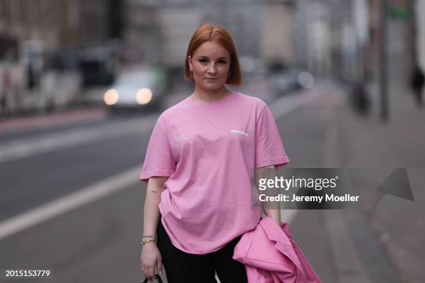 Elena Przkora seen wearing gold earrings, Hernameis pink logo print pattern oversized t-shirt, Jacquemus pink oversized blazer jacket, Zara black...