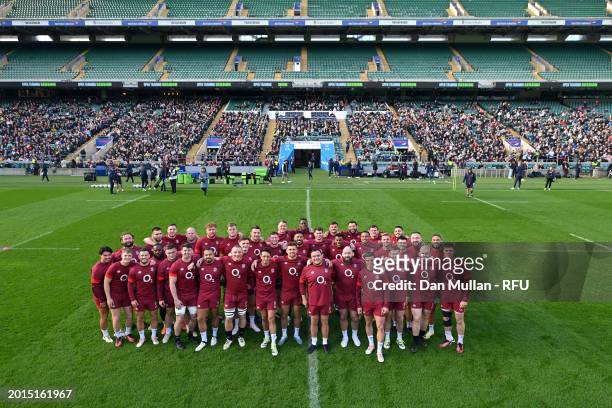 The England players pose for a group picture with the supporters who watched training prior to a training session at Twickenham Stadium on February...