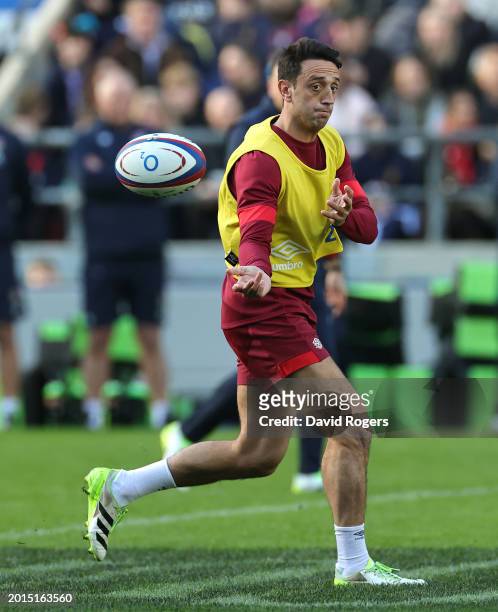 Alex Mitchell passes the ball during the England Open training session held at Twickenham Stadium on February 16, 2024 in London, England.
