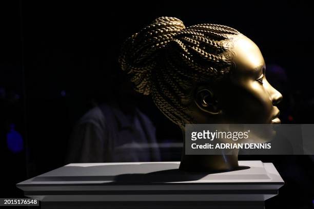 Photograph taken on February 19, 2024 shows a sculpture created by British artist Thomas J Price called "Ancient Feelings" and displayed during a...