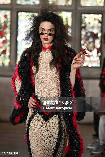 Model walks the runway at the Edward Crutchley show during London Fashion Week February 2024 at Ironmongers Hall, Barbican on February 16, 2024 in...