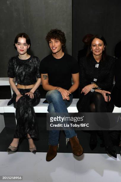 Delphi Primrose, Bobby Brazier and Caroline Rush attend the Sinead O'Dwyer show during London Fashion Week February 2024 at the BFC NEWGEN Show Space...