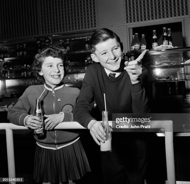 British figure skaters Carolyn Krau of Ickenham and her partner Rodney Ward of Roehampton, enjoy a soft drink after training at Queen's Ice Club in...