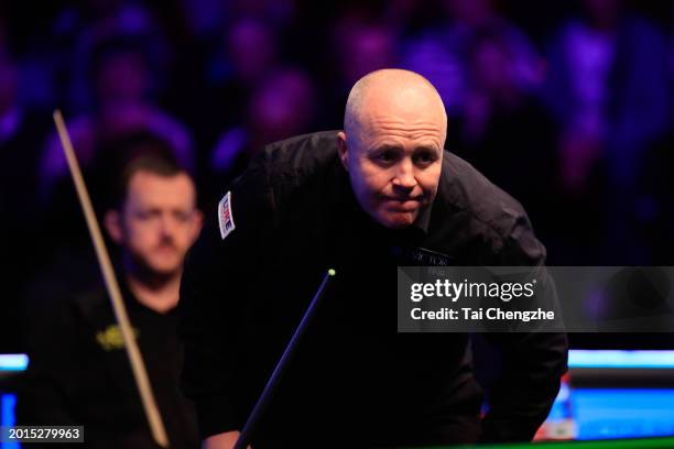 John Higgins of Scotland reacts in the Quarterfinal match against Mark Allen of Northern Ireland on day five of 2024 Betvictor Welsh Open at Venue...