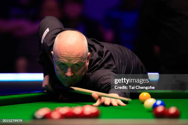 John Higgins of Scotland plays a shot in the Quarterfinal match against Mark Allen of Northern Ireland on day five of 2024 Betvictor Welsh Open at...