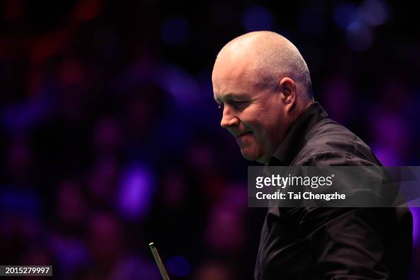 John Higgins of Scotland reacts in the Quarterfinal match against Mark Allen of Northern Ireland on day five of 2024 Betvictor Welsh Open at Venue...