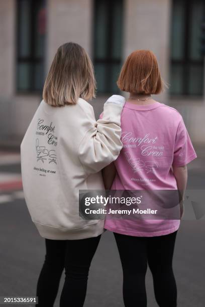 Elise Rozay seen wearing Hernameis creamy white logo print pattern oversized sweater with back print, Zara black split leggings pants; Elena Przkora...