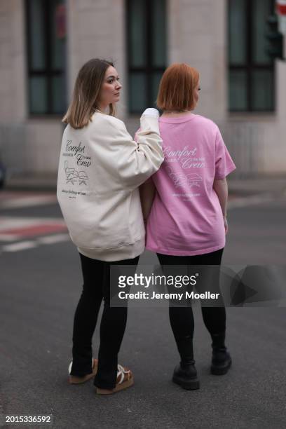 Elise Rozay seen wearing Hernameis creamy white logo print pattern oversized sweater with back print, Zara black split leggings pants, Hernameis...