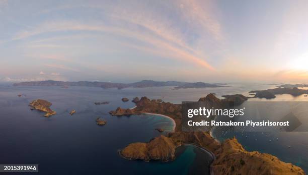 aerial drone sunrise scene of padar island in komodo national park, beautiful landscape indonesia, it is the third largest island part of komodo national park. - lawn aeration stock pictures, royalty-free photos & images