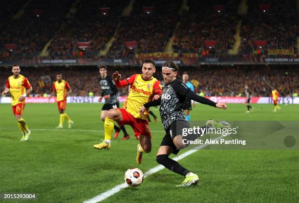 Lucas Hoeler of SC Freiburg is challenged by Ruben Aguilar of RC Lens during the UEFA Europa League 2023/24 Knockout Round Play-offs First Leg match...