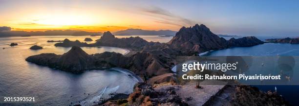 aerial drone sunset scene of padar island in komodo national park, beautiful landscape indonesia, it is the third largest island part of komodo national park. - lawn aeration stock pictures, royalty-free photos & images