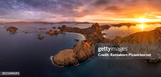 aerial drone sunrise scene of padar island in komodo national park, beautiful landscape indonesia, it is the third largest island part of komodo national park. - lawn aeration stock pictures, royalty-free photos & images