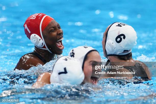 Ashleigh Johnson of Team United States celebrates with team mates after winning gold in the Women's Water Polo Gold Medal Match between Team United...