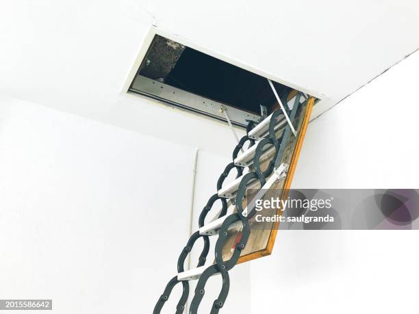 open attic hatch with ladder - herramientas profesionales stockfoto's en -beelden