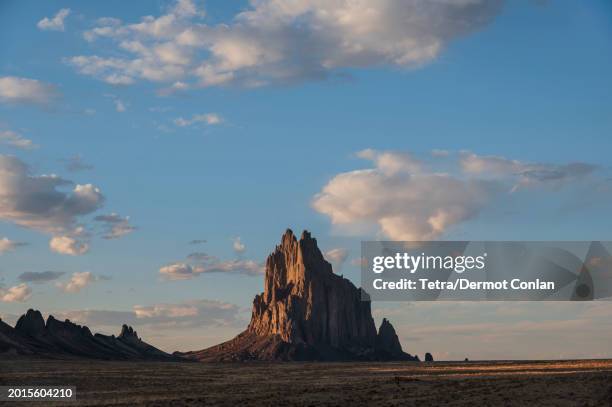 usa, new mexico, shiprock, clouds over desert landscape with shiprock - ship rock stock pictures, royalty-free photos & images