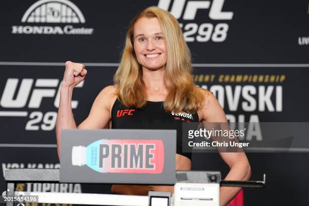 Andrea Lee poses on the scale during the UFC 298 official weigh-in at the Hyatt Regency Irvine on February 16, 2024 in Irvine, California.
