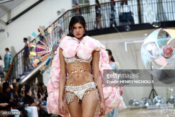 Model presents a creation by London-based designer Susan Fang during the Autumn/Winter 2024 collection catwalk presentation during London Fashion...