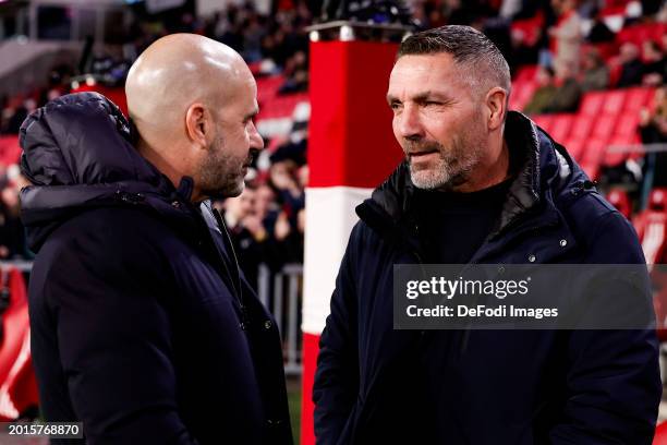 Head coach Peter Bosz of PSV Eindhoven and assistant coach Hendrie Kruzen of Heracles Almelo looks on prior to the Dutch Eredivisie match between PSV...