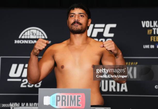 Junior Tafa of New Zealand poses on the scale during the UFC 298 official weigh-in at the Hyatt Regency Irvine on February 16, 2024 in Irvine,...