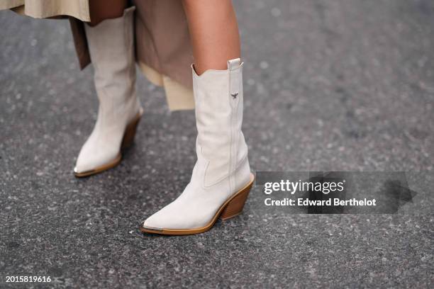 Guest wears white leather pointed boots with wooden high heels, outside La Pointe , during New York Fashion Week, on February 10, 2024 in New York...