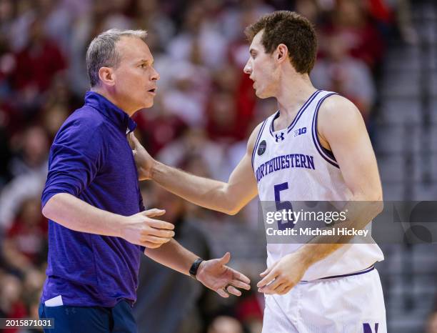 Head coach Chris Collins of the Northwestern Wildcats talks with Ryan Langborg of the Northwestern Wildcats during the game against the Indiana...