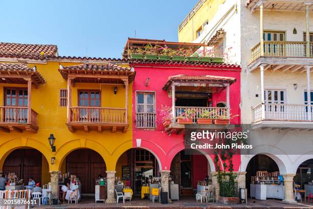 colorful buildings that line the square of the carriages (plaza de los coches). - plaza de los coches stock pictures, royalty-free photos & images