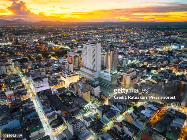 aerial shot sunset scene above the buildings of the core of downtown hatyai city, songkhla province, south of thailand, the skyscraper and office buildings of the financial district - pakistan skyline stock pictures, royalty-free photos & images