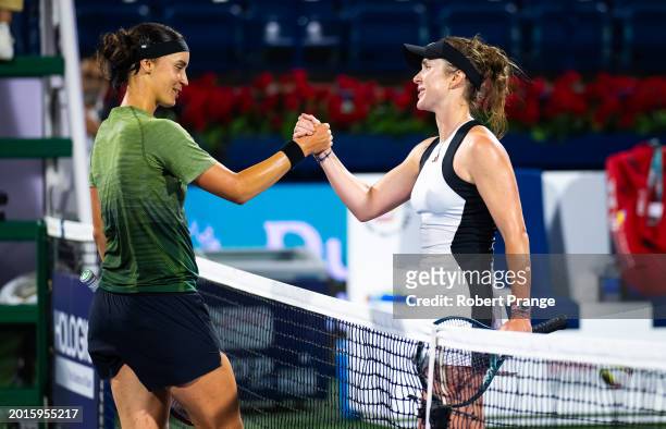 Anhelina Kalinina of Ukraine and Elina Svitolina of Ukraine shake hands at the net after the first round on Day 2 of the Dubai Duty Free Tennis...