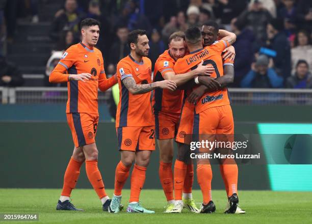 Marcus Thuram of FC Internazionale celebrates scoring his team's first goal with teammates during the Serie A TIM match between FC Internazionale and...