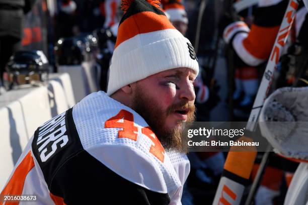 Nicolas Deslauriers of the Philadelphia Flyers looks on from the bench before a team photo and practice at MetLife Stadium on February 16, 2024 in...