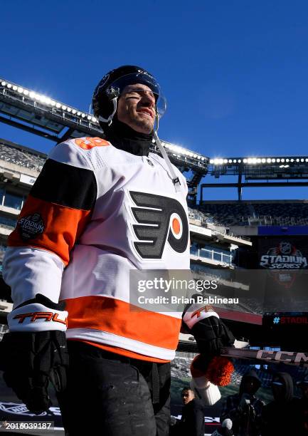 Garnet Hathaway of the Philadelphia Flyers makes his way to the ice surface for a team photo before practice at MetLife Stadium on February 16, 2024...