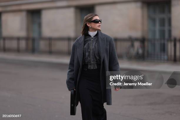 Sophia Geiss is seen wearing Mango black sunglasses, Acne Studios black / grey leather bomber jacket, Cos grey oversized long blazer jacket,...