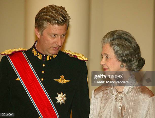 Belgian Crown Prince Philippe speaks with his aunt Queen Fabiola from Belgium May 20, 2003 in Brussels, Belgium. King Harald and Queen Sonja from...