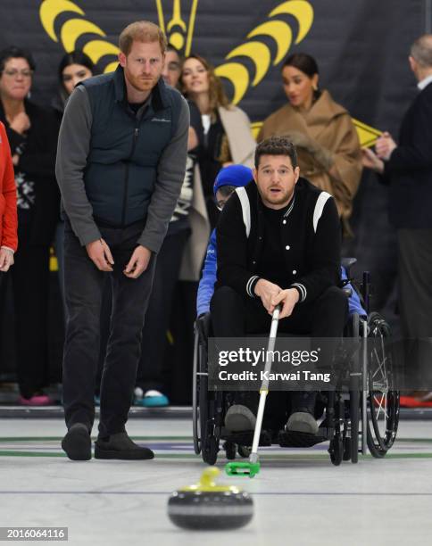 Prince Harry, Duke of Sussex, Meghan, Duchess of Sussex and Michael Bublé attend the Invictus Games One Year To Go Winter Training Camp at Hillcrest...