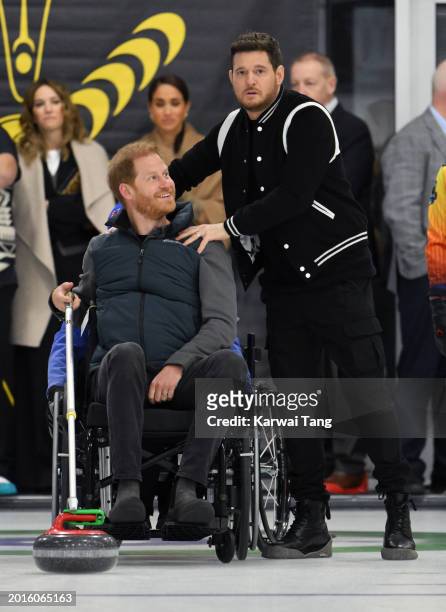 Prince Harry, Duke of Sussex, Meghan, Duchess of Sussex and Michael Bublé attend the Invictus Games One Year To Go Winter Training Camp at Hillcrest...