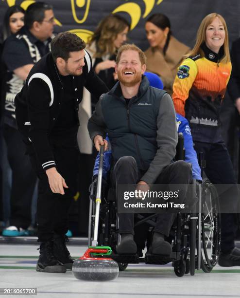 Prince Harry, Duke of Sussex, Meghan, Duchess of Sussex and Michael Bublé attend the Invictus Games One Year To Go Winter Training Camp at Hillcrest...