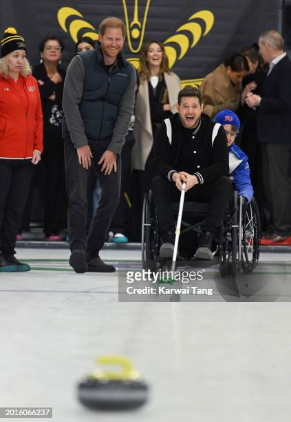 Prince Harry, Duke of Sussex and Michael Bublé attend the Invictus Games One Year To Go Winter Training Camp at Hillcrest Community Centre on...