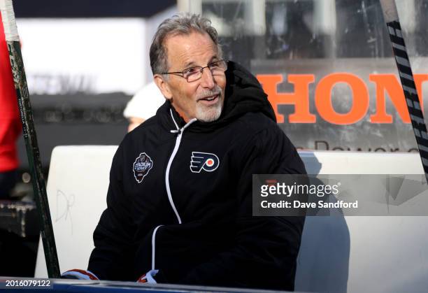 Head Coach John Tortorella of the Philadelphia Flyers looks on from the bench during practice at MetLife Stadium on February 16, 2024 in East...