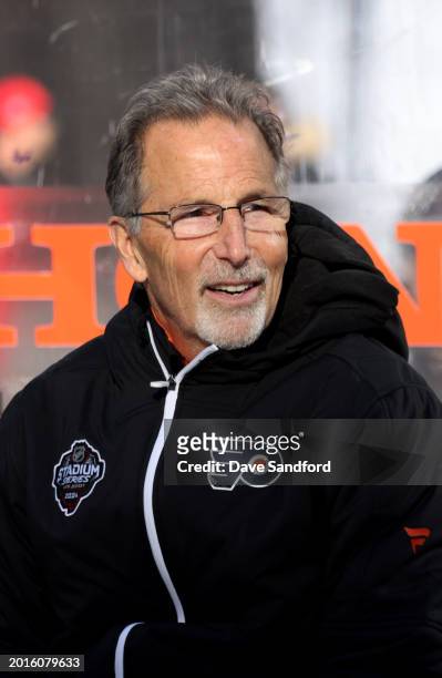 Head Coach John Tortorella of the Philadelphia Flyers looks on from the bench during practice at MetLife Stadium on February 16, 2024 in East...