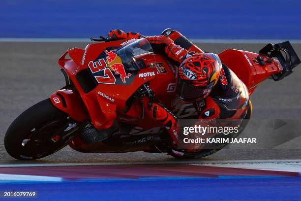 Red Bull GASGAS Tech3's Spanish rider Augusto Fernandez steers his bike on the first day of the MotoGP pre-season testing at Lusail International...