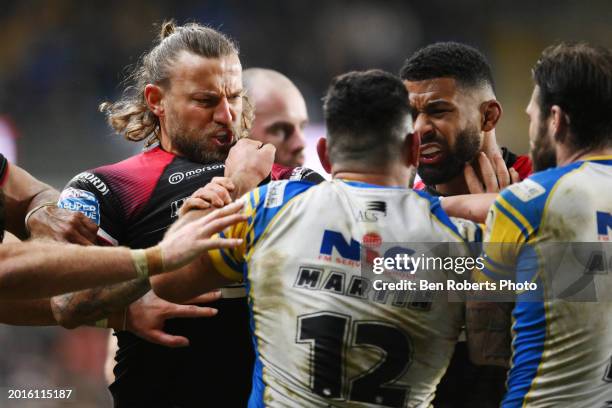 Chris Hankinson of Salford Red Devils and Rhyse Martin of Leeds Rhinos come together during the Betfred Super League match between Leeds Rhinos and...