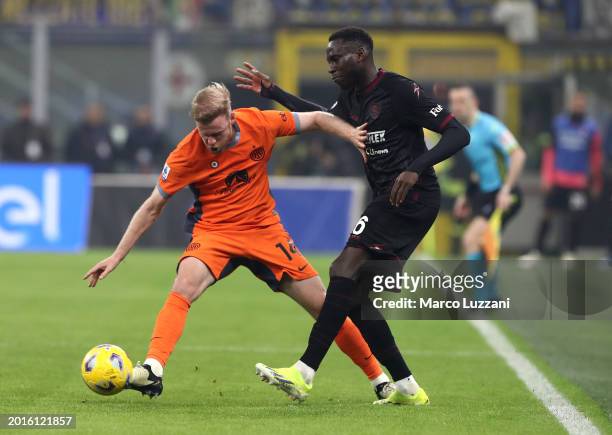 Davy Klaassen of FC Internazionale holds off Junior Sambia of US Salernitana during the Serie A TIM match between FC Internazionale and US...