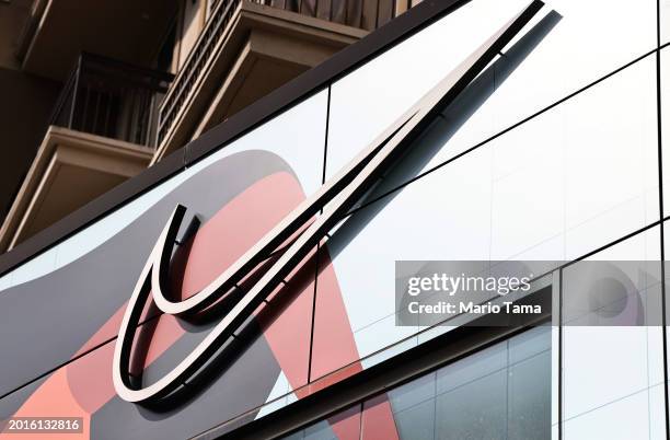 The Nike logo is displayed at a Nike Well Collective store on February 16, 2024 in Glendale, California. Nike announced it laying off 2 percent of...