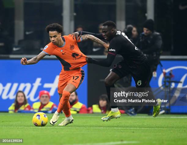 Tajon Buchanan of FC Internazionale competes for the ball with Junior Sambia of US Salernitana during the Serie A TIM match between FC Internazionale...