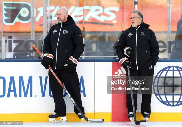 Assistant coach Darryl Williams and head coach John Tortorella of the Philadelphia Flyers conduct practice at MetLife Stadium on February 16, 2024 in...