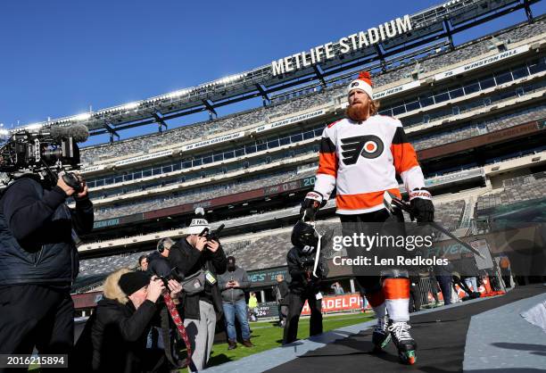 Marc Staal of the Philadelphia Flyers makes his way to the ice surface for a team photo before practice at MetLife Stadium on February 16, 2024 in...