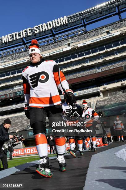Owen Tippett of the Philadelphia Flyers makes his way to the ice surface for a team photo before practice at MetLife Stadium on February 16, 2024 in...
